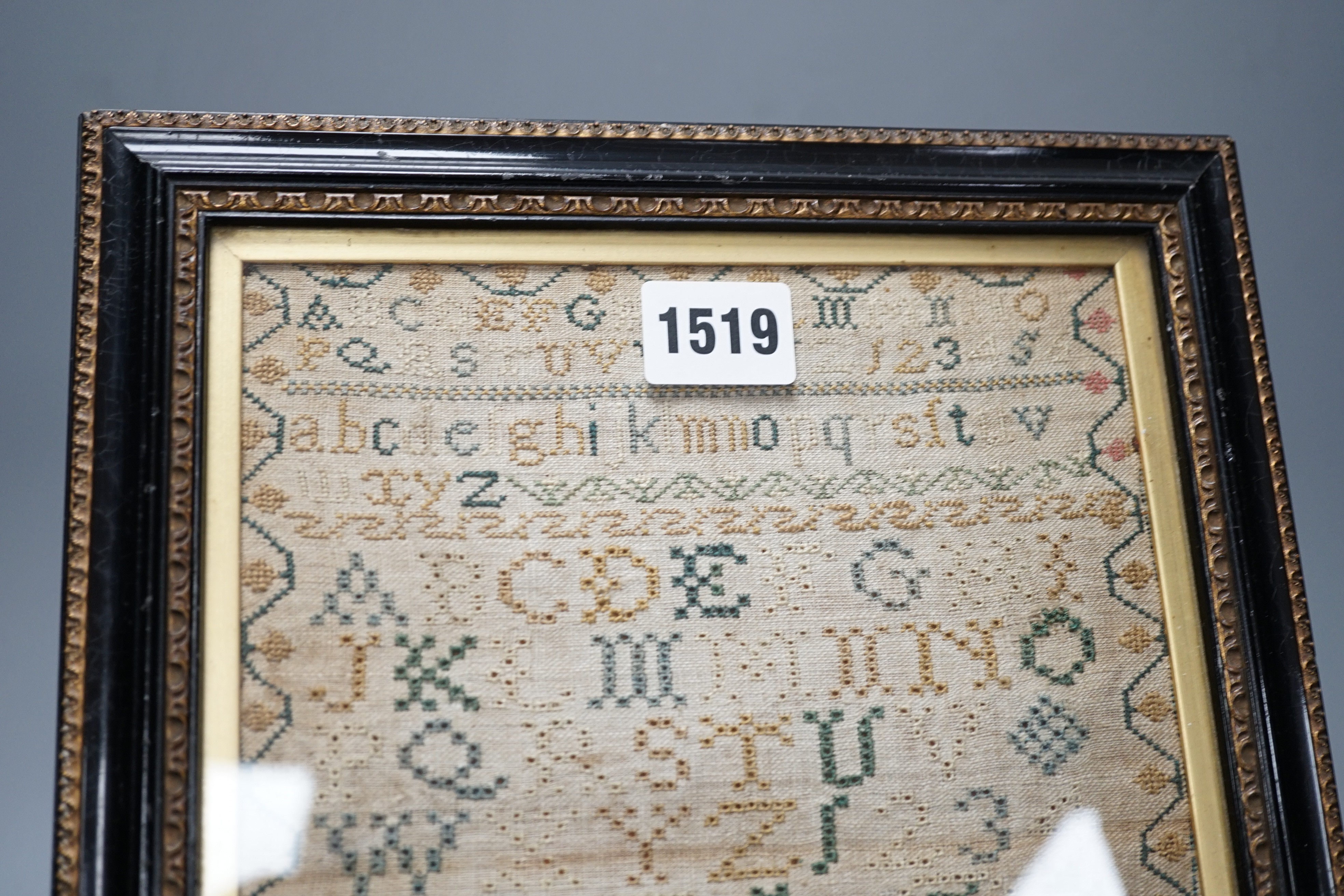 A George III sampler by Mary Bull, dated July 23 1799, 18cms wide x 23.5 high